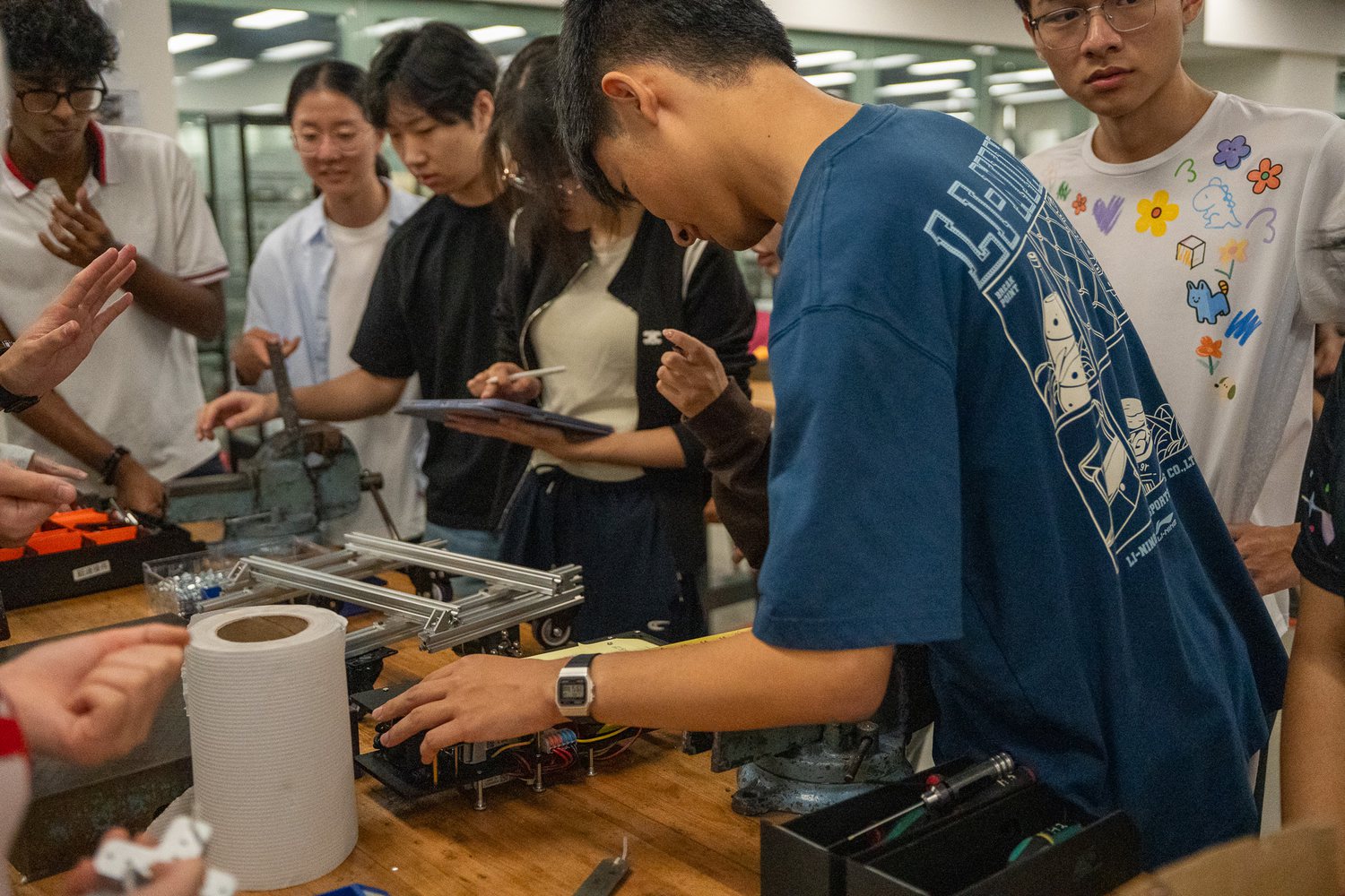 Students testing robotics systems during hands-on training